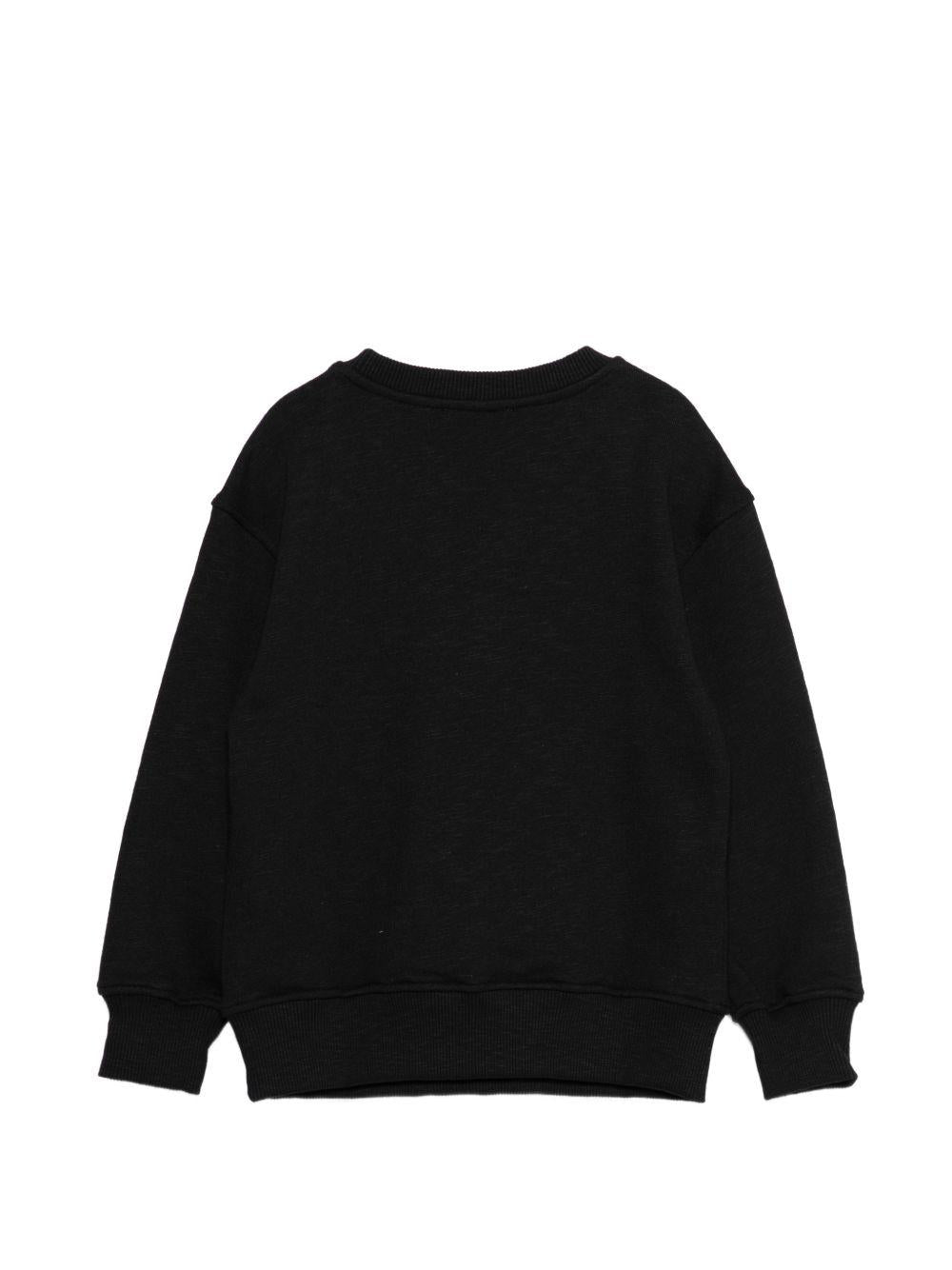 Felpa per bambino Moschino Kids nera con stampa logo all-over HUF09LLCA88 60100 MOSCHINO KIDS 