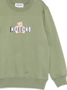 Felpa per bambini Moschino Kids verde con motivo Teddy Bear HUF09ULCA19 30037 MOSCHINO KIDS 