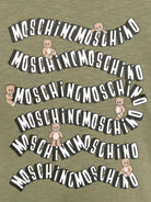 T-shirt per bambini Moschino Kids verde con stampa logo ondulata HXM05GLAA52 30037 MOSCHINO KIDS 