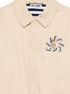 Giubbino per bambino Moschino Kids beige con stampa logo HUS05MLYA02 20829 MOSCHINO KIDS 
