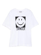 T-shirt per bambino Moschino Kids bianco con motivo smiley HSM05GLAA01 10101 MOSCHINO KIDS 