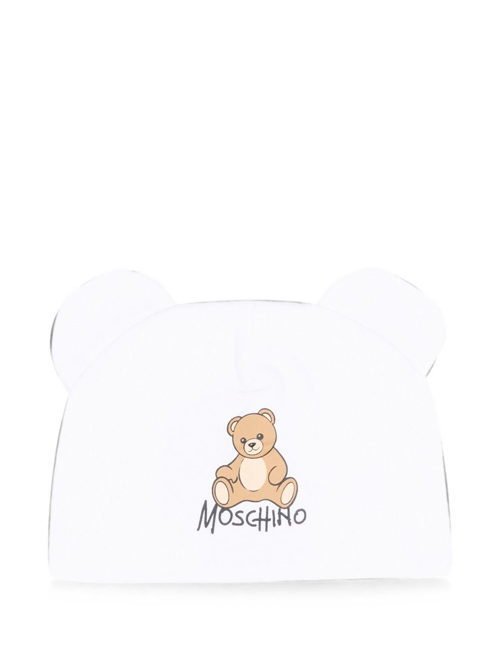 Berretto per neonati Moschino Kids bianco con motivo Teddy bear MMX05HLCA40 10101 MOSCHINO KIDS 