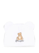 Berretto per neonati Moschino Kids bianco con motivo Teddy bear MMX05HLCA40 10101 MOSCHINO KIDS 