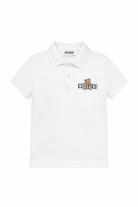 Polo da bambino Moschino Kids bianca con stampa orsacchiotto HSM03YLFA09 10101 MOSCHINO KIDS 