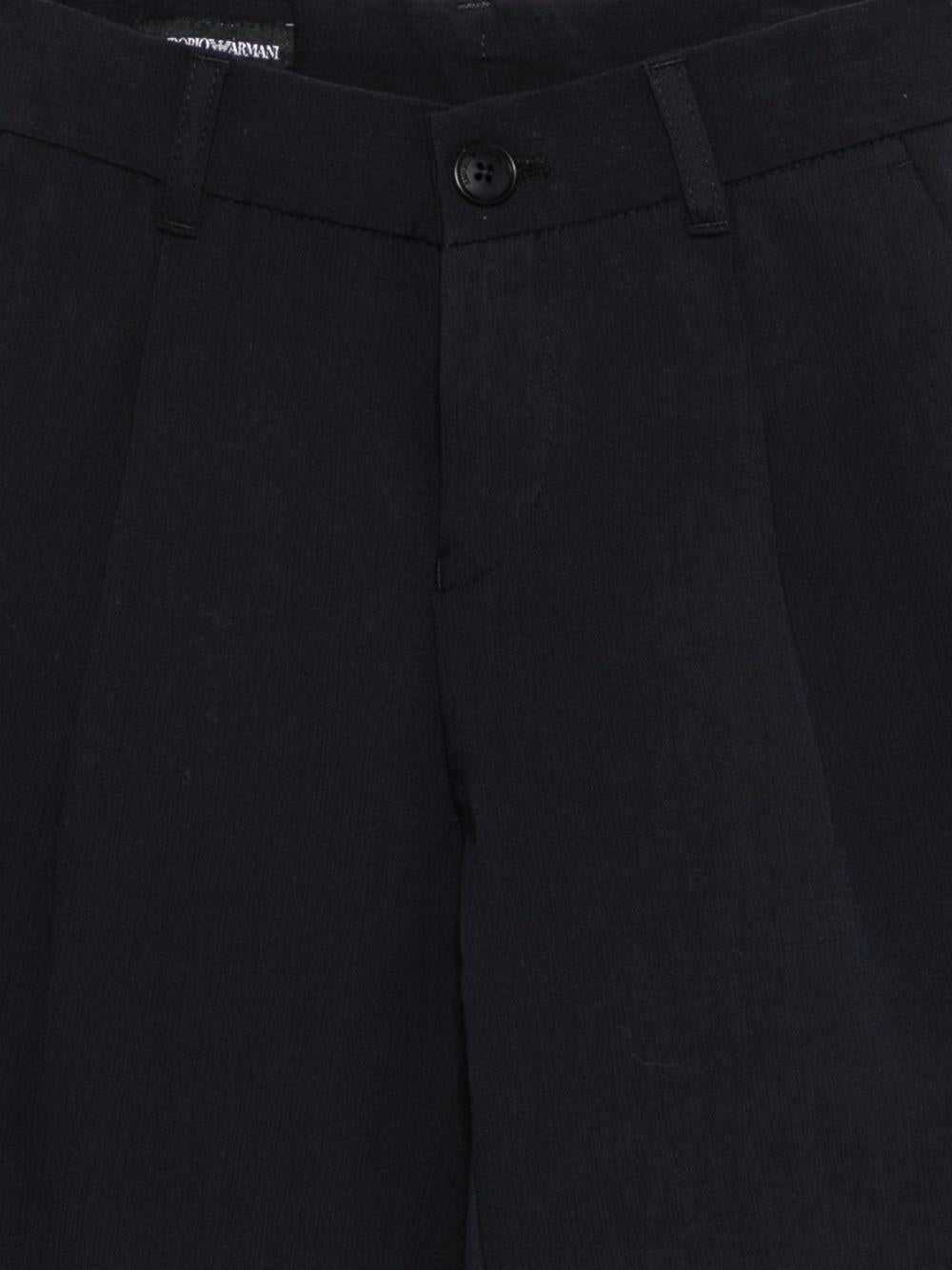 Pantaloni per bambino Emporio Armani Kids blu con dettagli plissettati EB000903 AF21040 UB109 EMPORIO ARMANI KIDS 