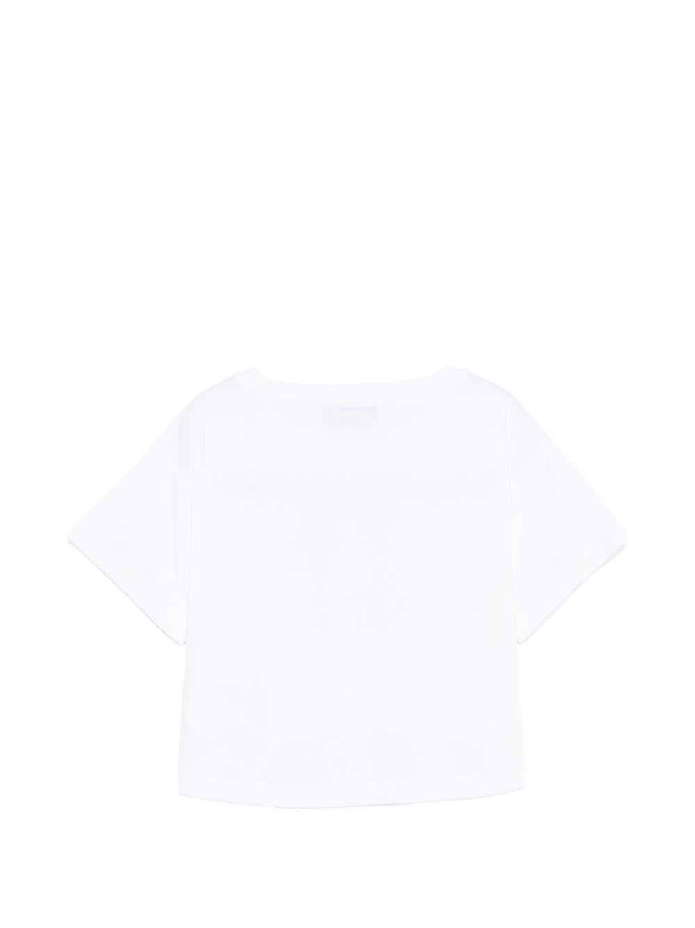T-shirt per bambina Moschino Kids bianca con design crop HDM070LAA02 10101 MOSCHINO KIDS 