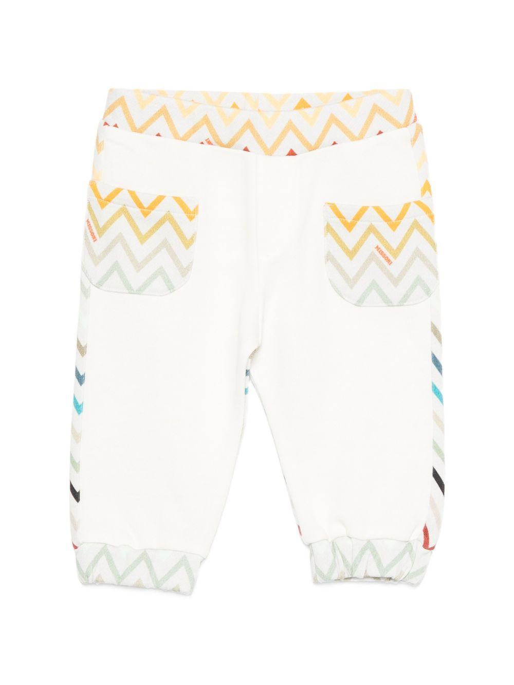 Pantaloni sportivi per neonato Missoni Kids bianchi con motivo a zigzag MZ6300 Z3183 102MC MISSONI KIDS 