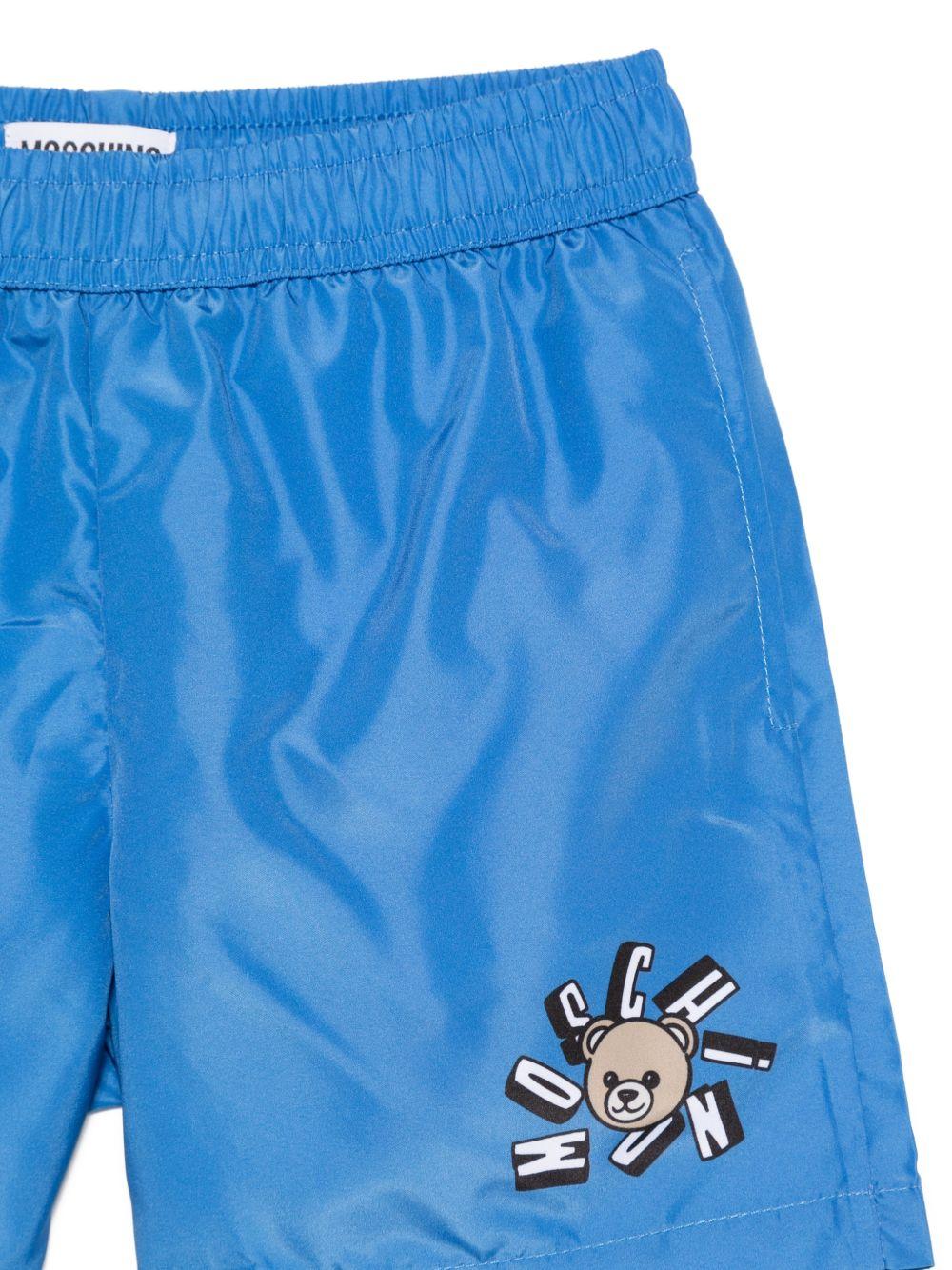 Costume da bagno per bambino Moschino Kids azzurro con stampa logo HUL01LLKA02 40630 MOSCHINO KIDS 