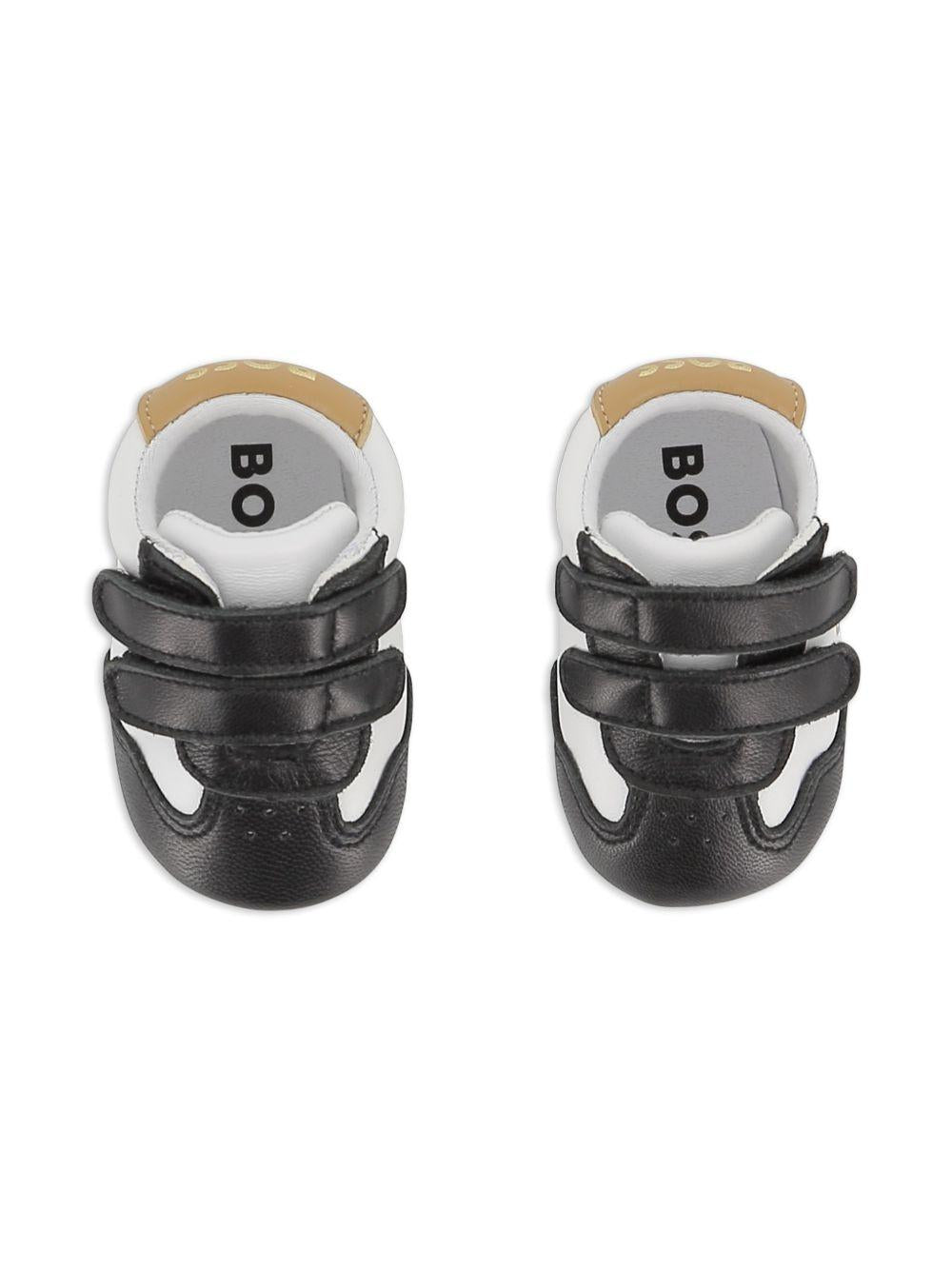 Scarpine primi passi per neonato Boss Kids bianche e nere con design a inserti J53243 09B BOSS KIDS 