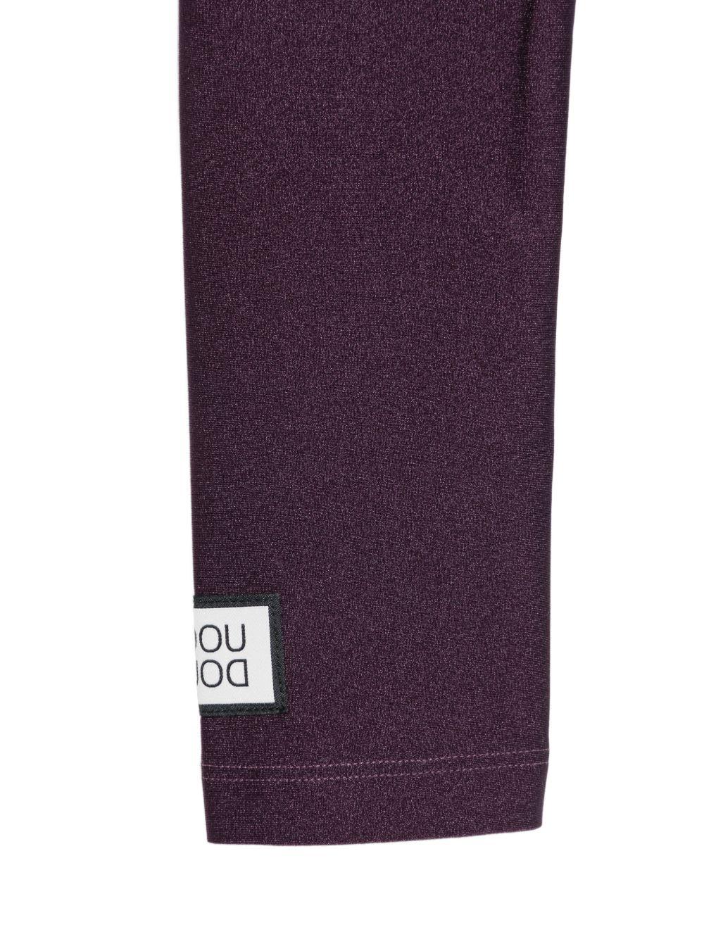Leggins per bambina Douuod Kids viola con logo applicato sul lato DY6A20 J0331 558 DOUUOD KIDS 