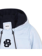 Tuta da neve per neonato BOSS Kids azzurra con cappuccio J52516 771 BOSS KIDS 