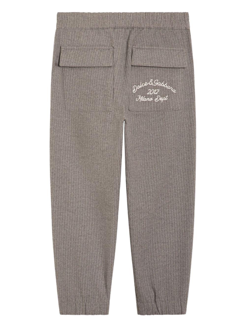 Pantaloni per bambino Dolce & Gabbana Kids grigi con motivo gessato L44P90 FURN5 S8051 DOLCE & GABBANA KIDS 