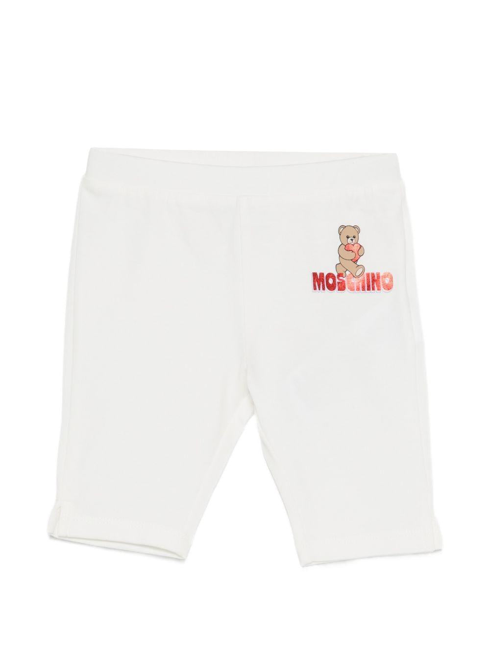 Leggins per neonata Moschino Kids bianchi con logo sul davanti MDP03JLBA00 10063 MOSCHINO KIDS 