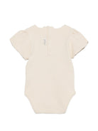 Tutina per neonata Donsje beige con dettaglio fiore sul davanti 3032705 00004 DONSJE KIDS 