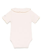 Body per neonata Donsje Bettie rosa con dettagli in pizzo 3035900 00009 DONSJE 