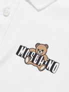 Polo da bambino Moschino Kids bianca con stampa orsacchiotto HSM03YLFA09 10101 MOSCHINO KIDS 