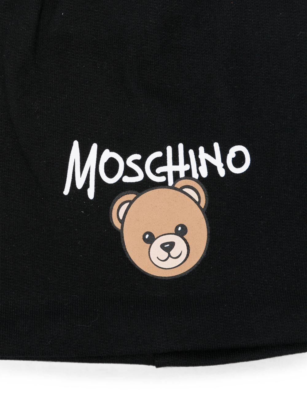 Berretto per bambino Moschino Kids nero con stampa grafica HNX02MLCA94 60100 MOSCHINO KIDS 