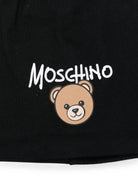 Berretto per bambino Moschino Kids nero con stampa grafica HNX02MLCA94 60100 MOSCHINO KIDS 