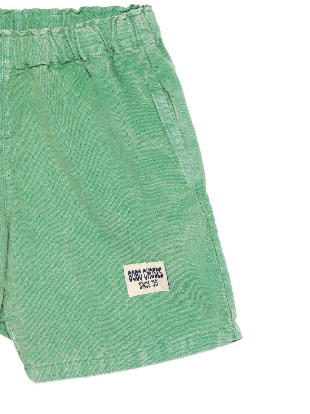Shorts per bambino Bobo Choses verde con toppa con logo sul davanti B126AC066 311 BOBO CHOSES KIDS 