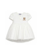 Abito per neonata Moschino Kids bianco con ricamo Teddy Bear MDV0DBLAA55 10063 MOSCHINO KIDS 