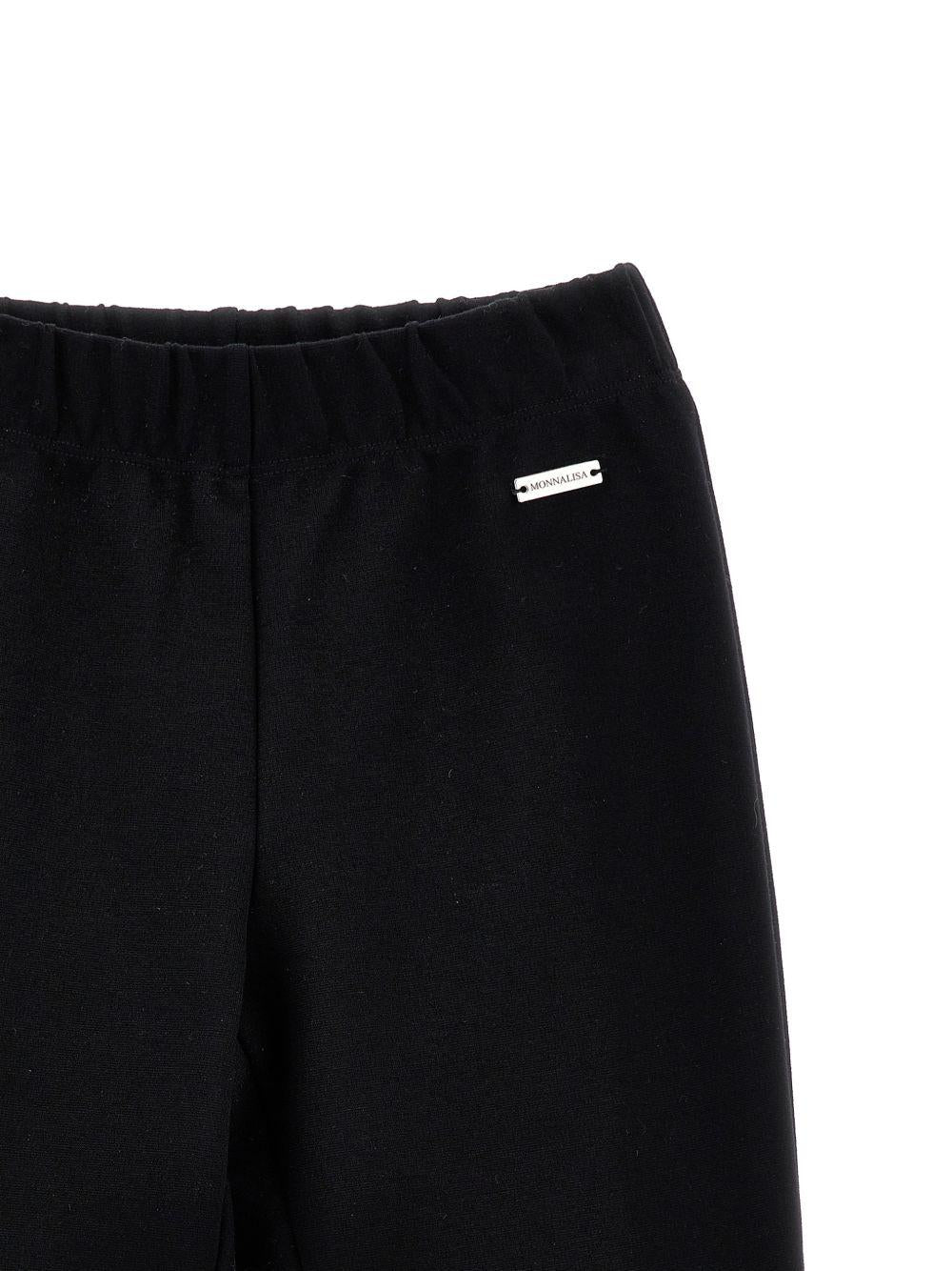 Pantaloni svasati per bambina Monnalisa Kids neri con placca logo 17H403 8220 0050 MONNALISA KIDS 