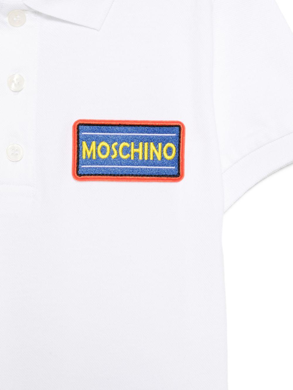 T-shirt per bambino Moschino Kids bianco con colletto stile polo HTM03YLFA09 10101 MOSCHINO KIDS 