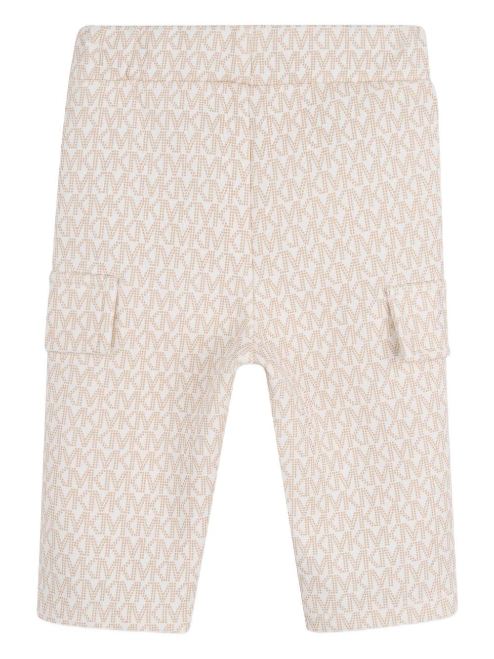 Tuta sportiva per neonata Michael Kors Kids bianco con stampa logo all-over R30548 190 MICHAEL KORS KIDS 