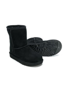 Stivaletti con fodera in pelliccia per bambina UGG Kids neri con punta tonda 1017703K BLK UGG 