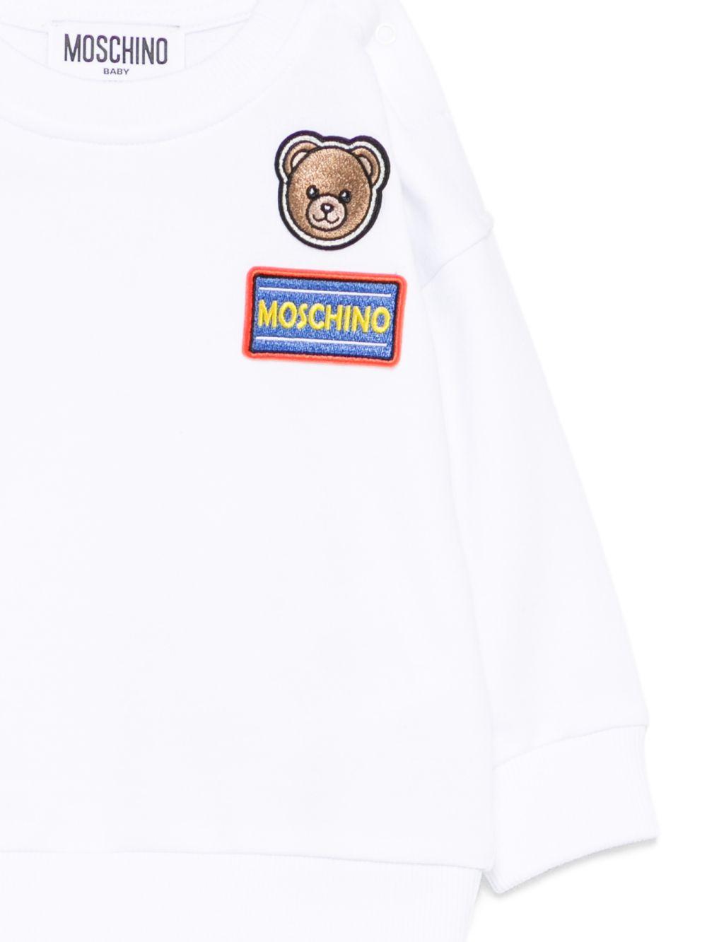 Felpa per neonati Moschino Kids bianca con dettagli in rilievo M9F03QLCA19 10101 MOSCHINO KIDS 