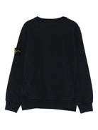 Felpa per bambino Stone Island Kids nera con applicazione sulla manica L2S166100001S0A20 V0029 STONE ISLAND KIDS 