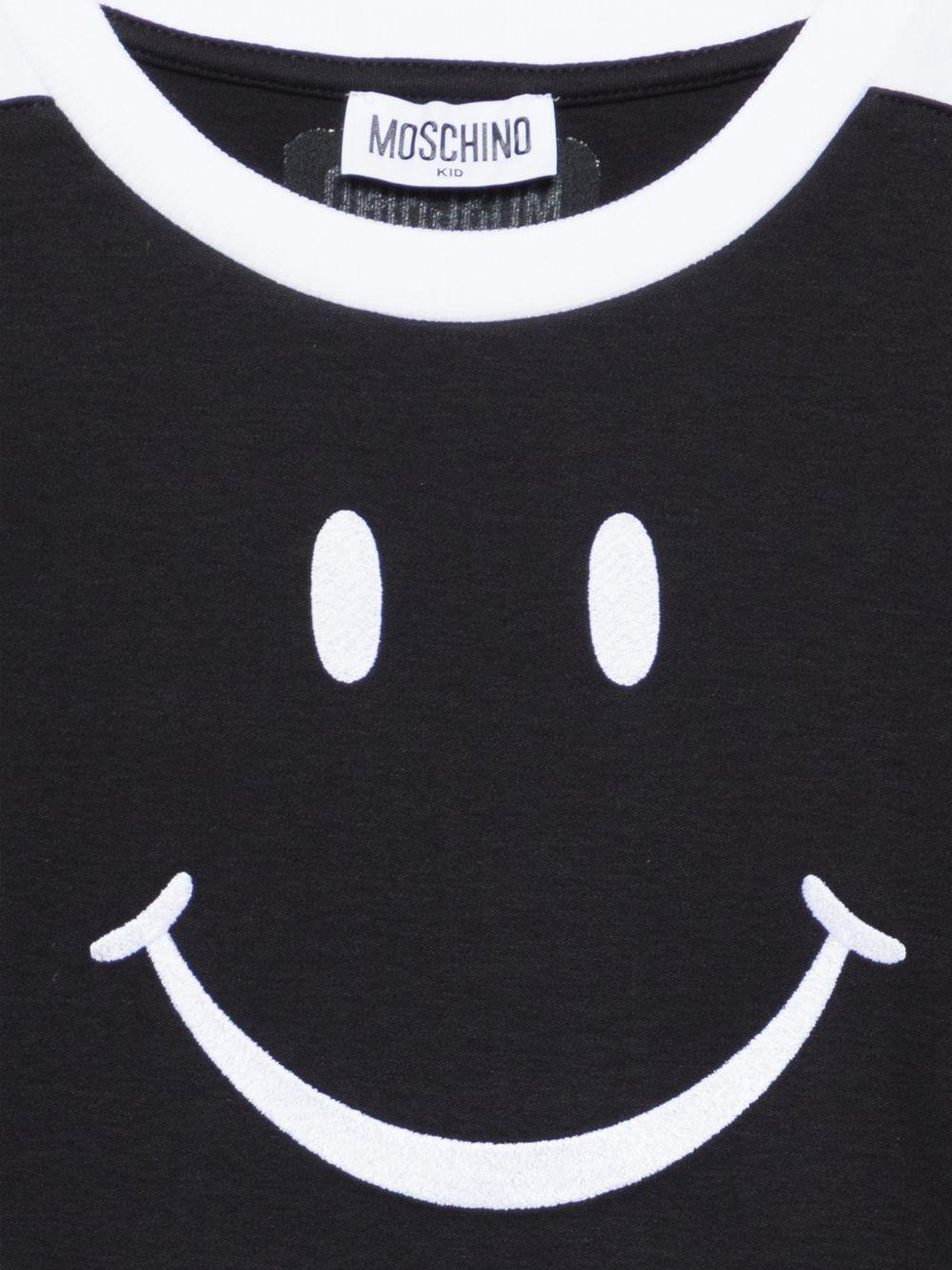 T-shirt per bambino Moschino Kids nera con stampa smile sul davanti HUM05NLAA43 60100 MOSCHINO KIDS 