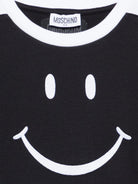 T-shirt per bambino Moschino Kids nera con stampa smile sul davanti HUM05NLAA43 60100 MOSCHINO KIDS 