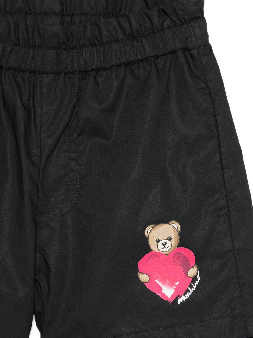 Shorts per neonata Moschino Kids nero con stampa grafica sul davanti MDQ00FLLA10 60100 MOSCHINO KIDS 