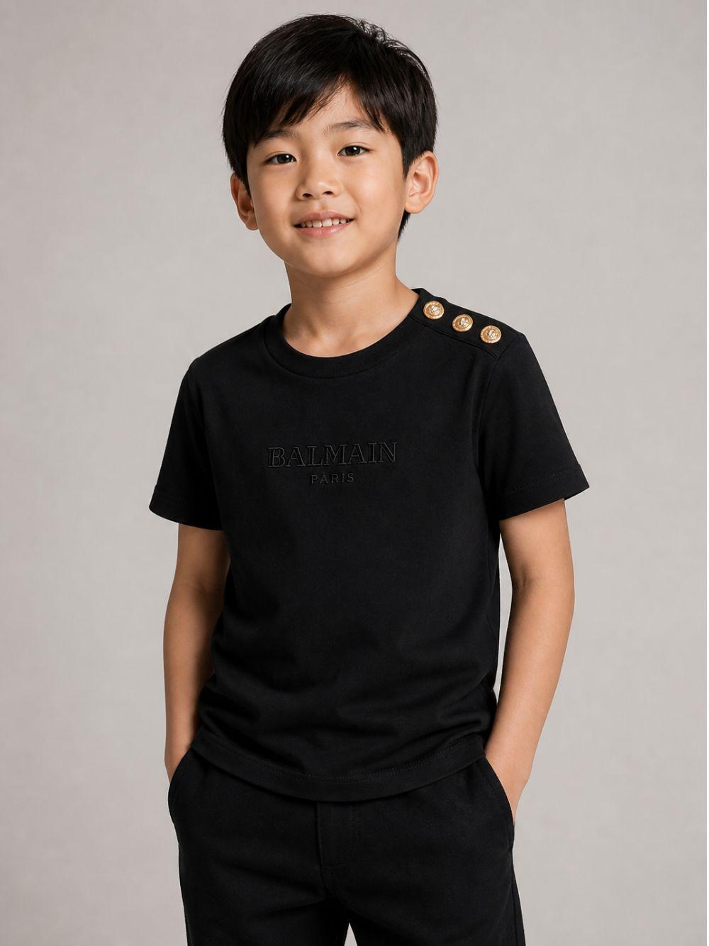 T-shirt per bambini Balmain Kids nera con dettaglio bottoni sulla spalla BZ8I81 Z3672 930OR BALMAIN KIDS 
