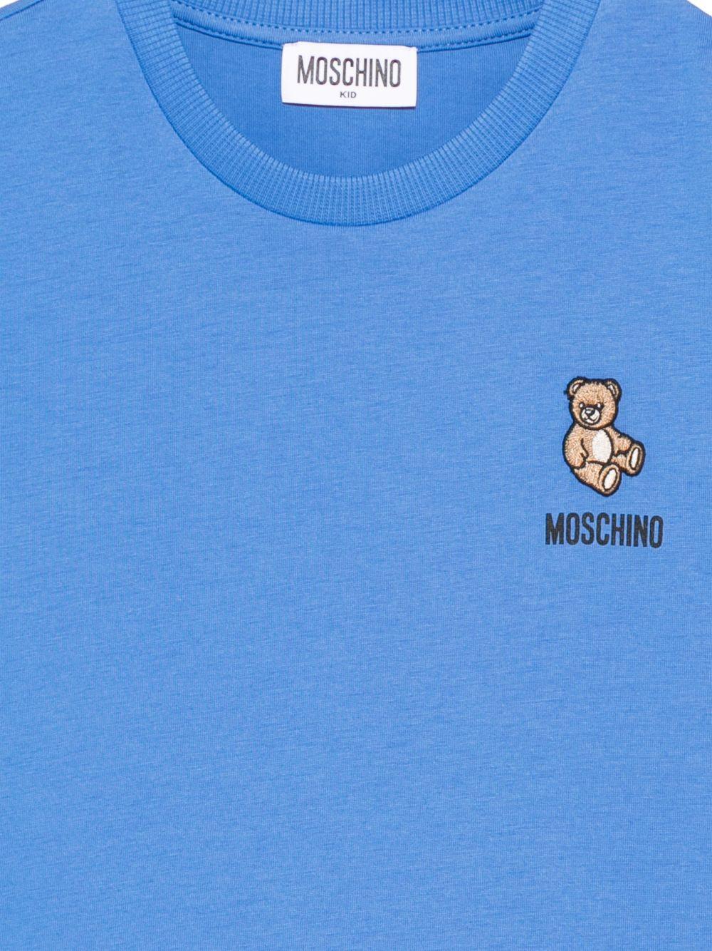 T-shirt per bambini Moschino Kids azzurro con applicazione Teddy Bear HUM05TLAA02 40630 MOSCHINO KIDS 