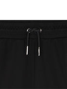 Pantaloni sportivi per bambina DKNY Kids neri con logo D62368 09B DKNY 