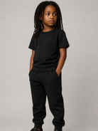 Pantaloni per bambino Balmain Kids neri con logo ricamato sul davanti BZ6I00 Z3183 930 BALMAIN KIDS 