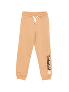 Pantaloni sportivi per bambino Timberland Kids beige con logo sulla gamba T60974 230 TIMBERLAND KIDS 