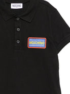Polo per bambino Moschino Kids nero con targhetta logo HTM03YLFA09 60100 MOSCHINO KIDS 