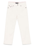 Jeans affusolati per bambino Tommy Hilfiger Junior bianco con design cinque tasche - Rubino Kids