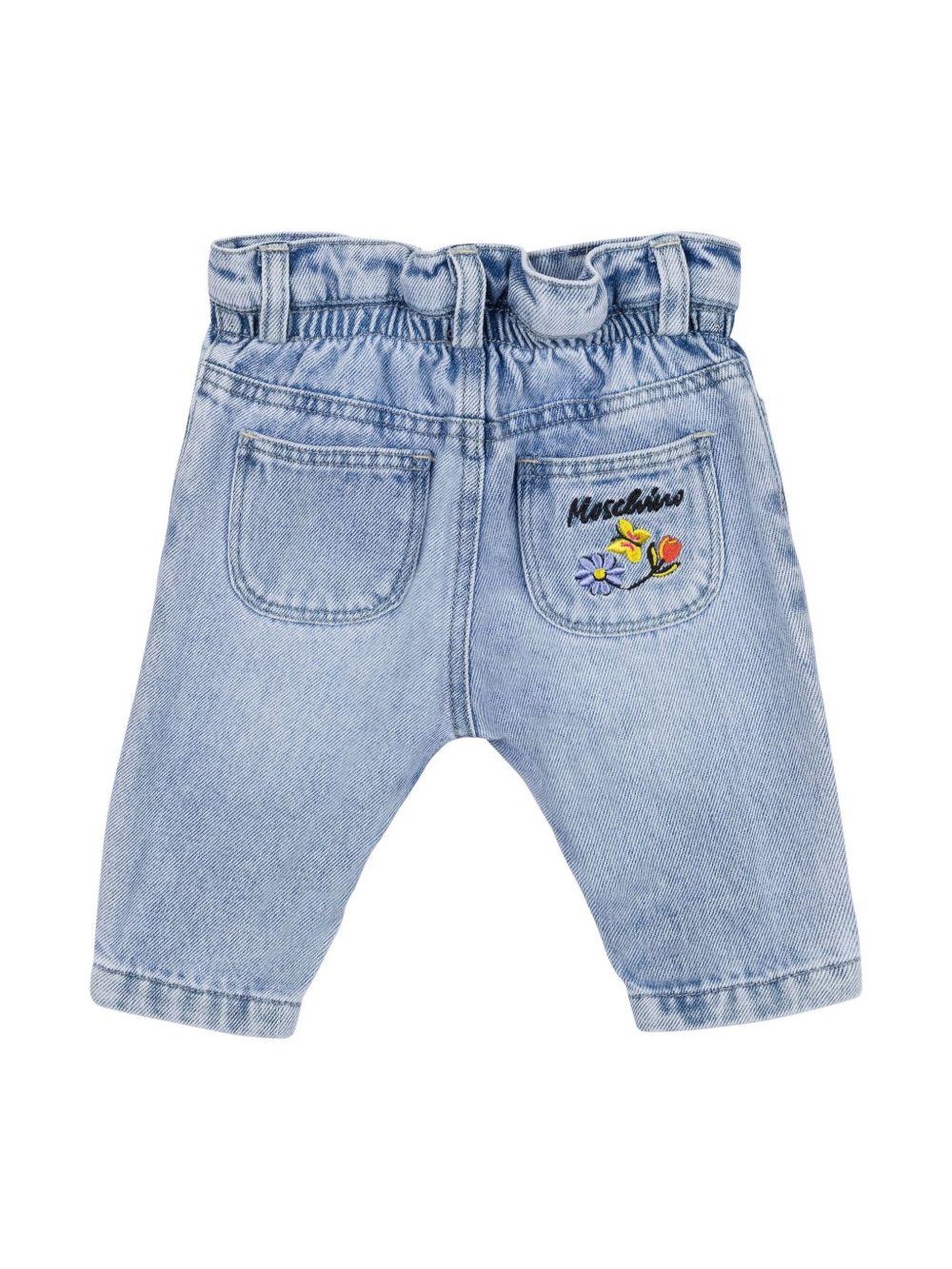 Jeans con ricamo a fiori per neonarto Moschino Kids azzurro con passanti - Rubino Kids