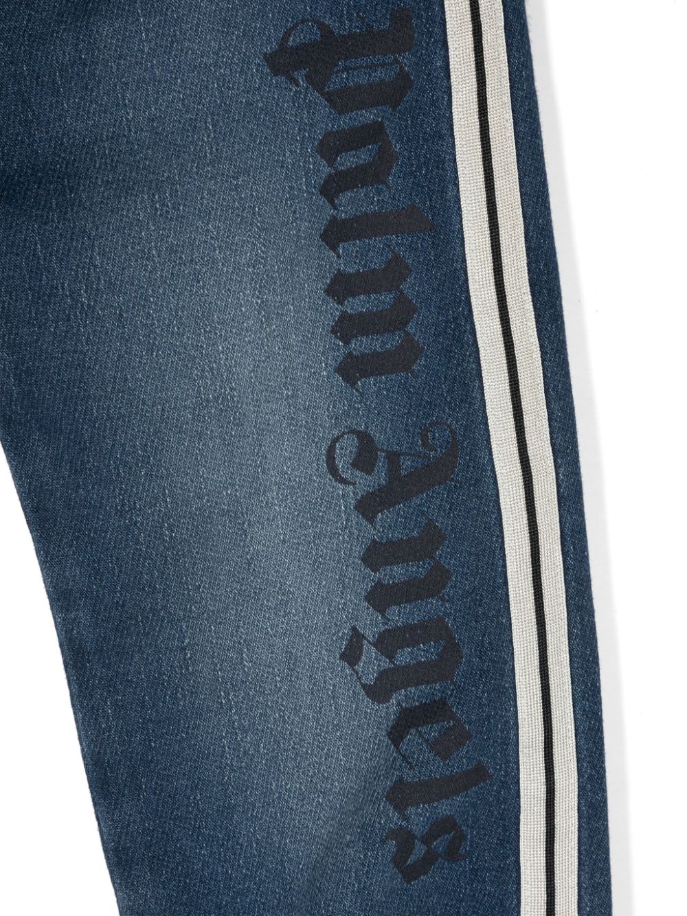 Jeans con stampa per bambino Palm Angels Kids blu con taglio dritto - Rubino Kids