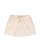 Pantaloncini di cotone ricamati a fiori per bambina ZIMMERMANN Kids beige con orlo smerlato - Rubino Kids