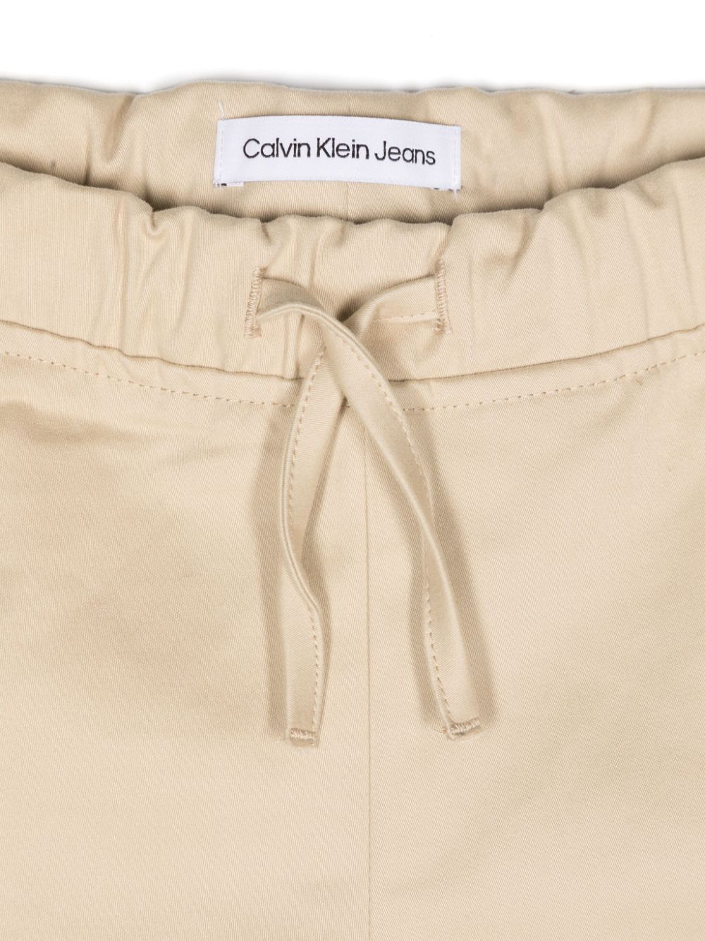 Pantaloni a palazzo per neonato Calvin Klein Kids beige con ricamo logo laterale - Rubino Kids