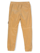 Pantaloni affusolati con applicazione Compass per bambino Stone Island Junior beige con velluto a coste - Rubino Kids