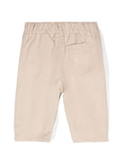 Pantaloni con motivo Equestrian Knight per neonato Burberry Kids beige con dettagli plissettati - Rubino Kids