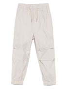 Pantaloni Parachute per bambino Calvin Klein Kids beige con tasca posteriore a filetto - Rubino Kids