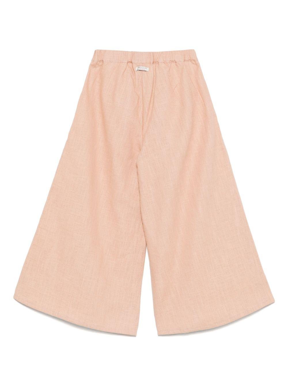 Pantaloni per bambina Donsje Fifis rosa con applicazione a fiori - Rubino Kids