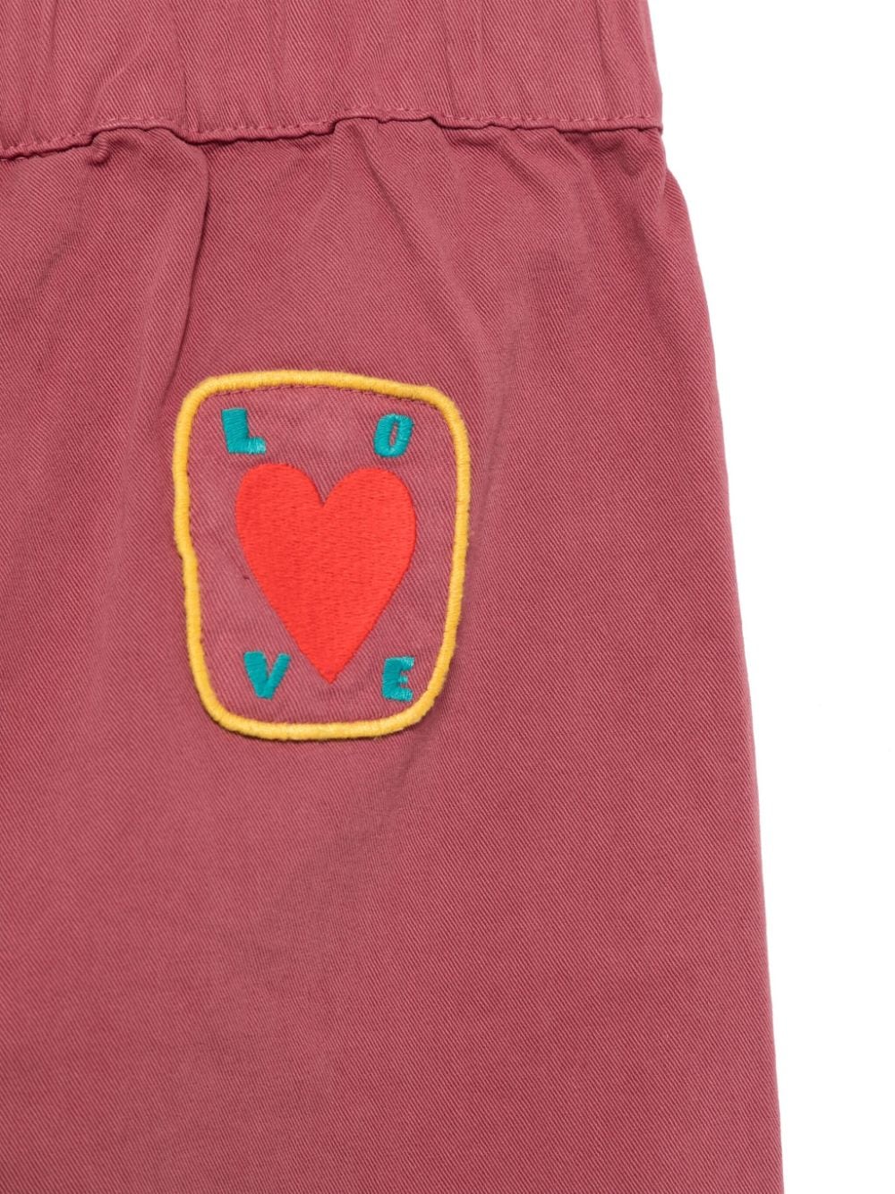 Pantaloni per bambina JELLYMALLOW rosa magenta con stampa Love - Rubino Kids