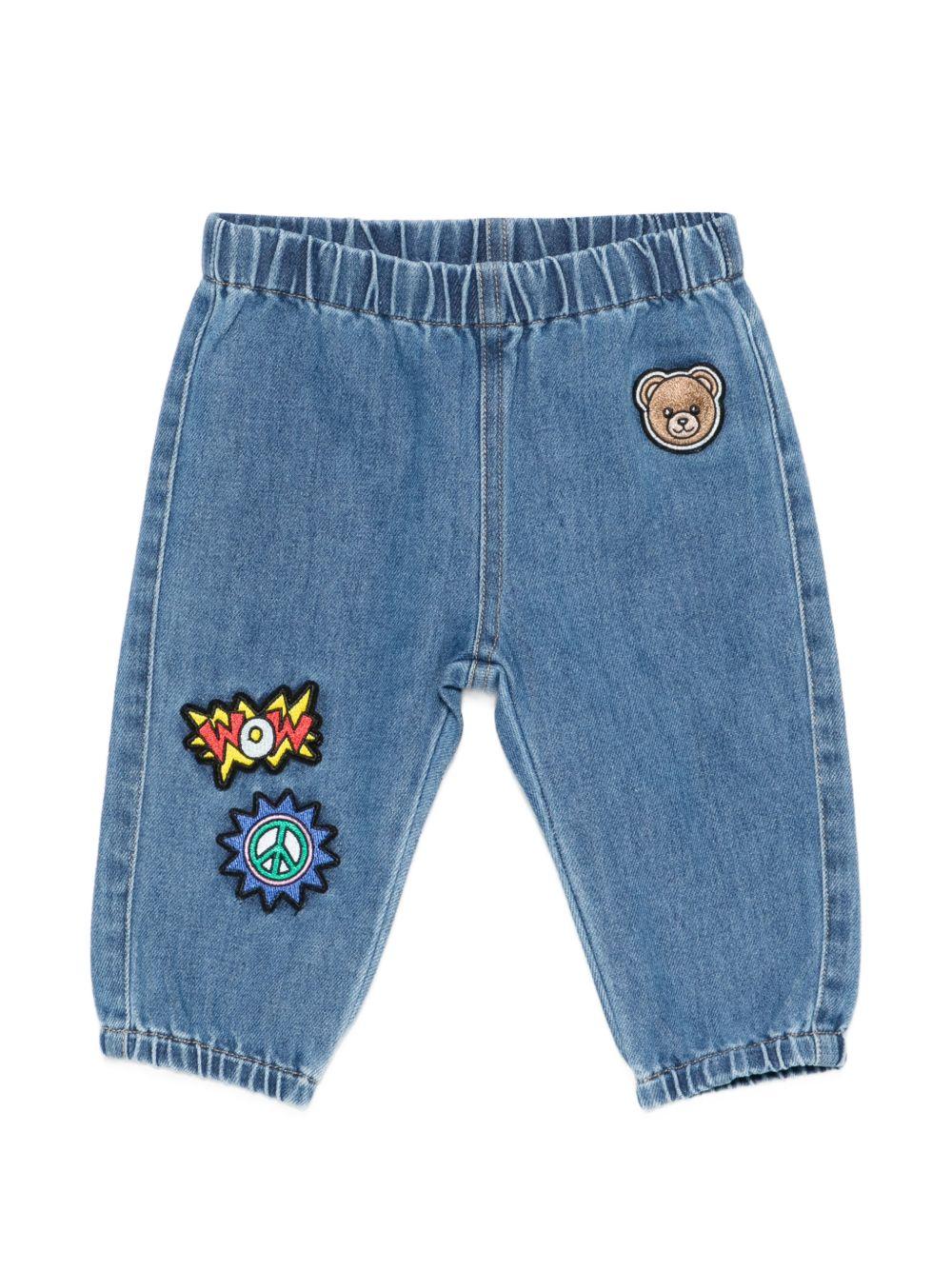 Pantaloni per neonato Moschino Kids denim con toppe ricamate - Rubino Kids